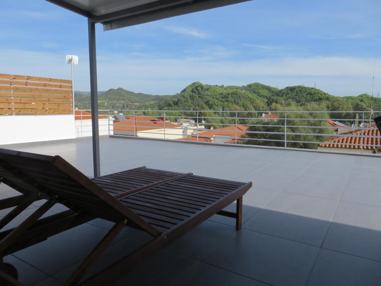 Leonidaion Guesthouse Ancient Olympia Bagian luar foto A roof terrace in Spain